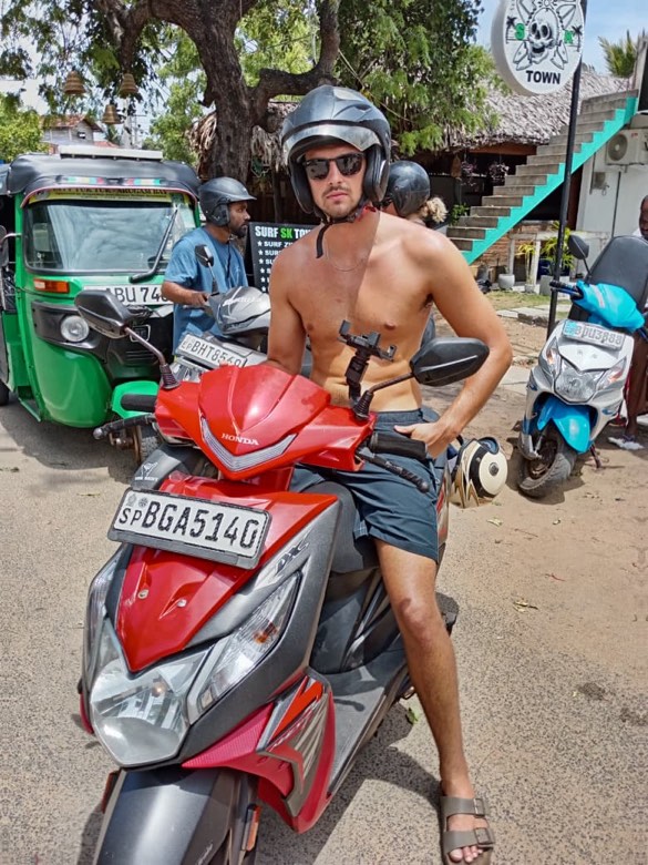 A happy customer on an SP rental scooter in Arugam Bay