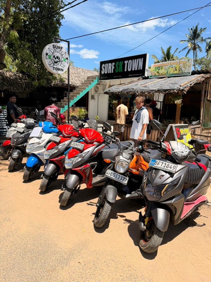 SP Scooter & Taxi's rental scooters lined up, helmets ready